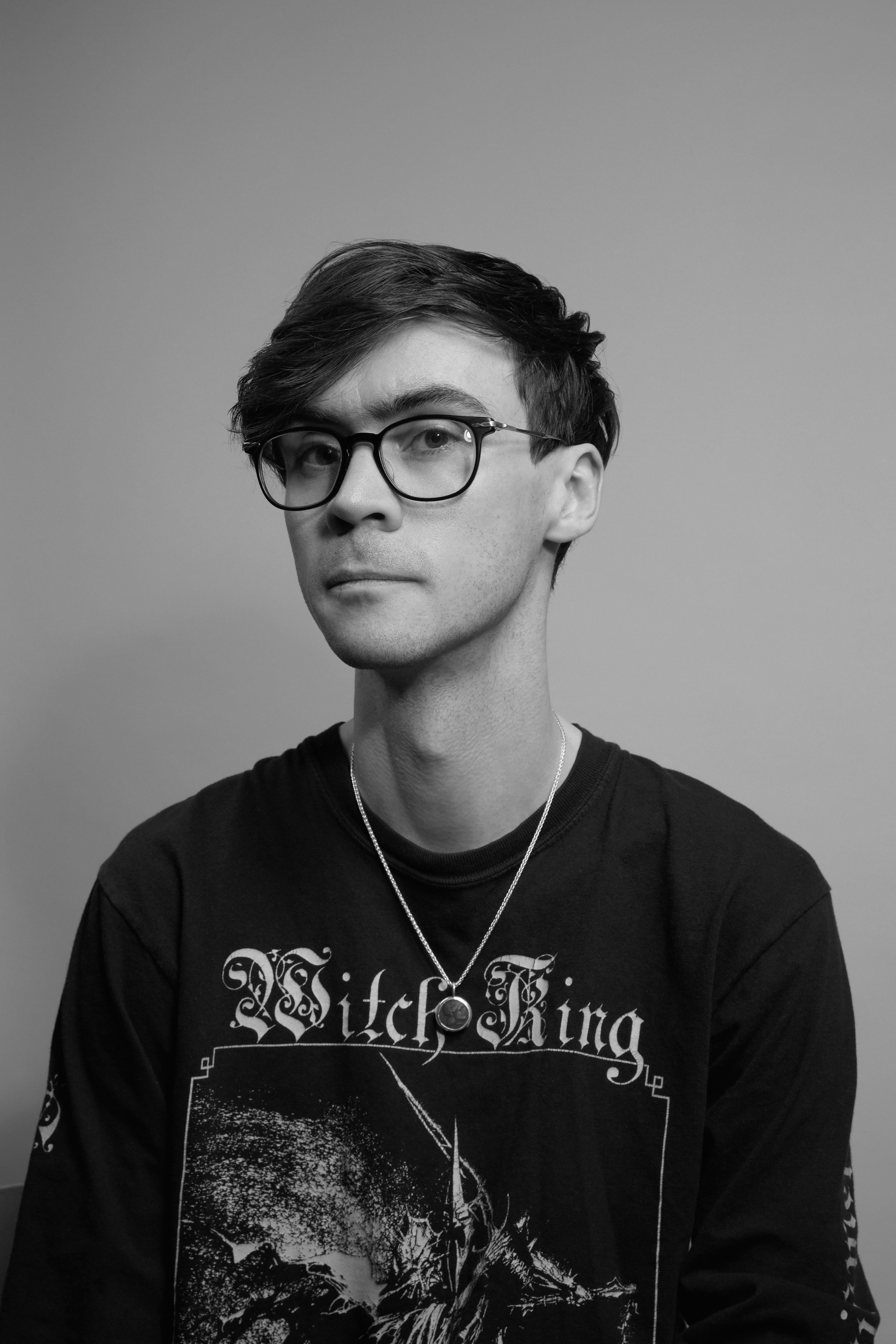 Nick Frosst in a black t-shirt and glasses