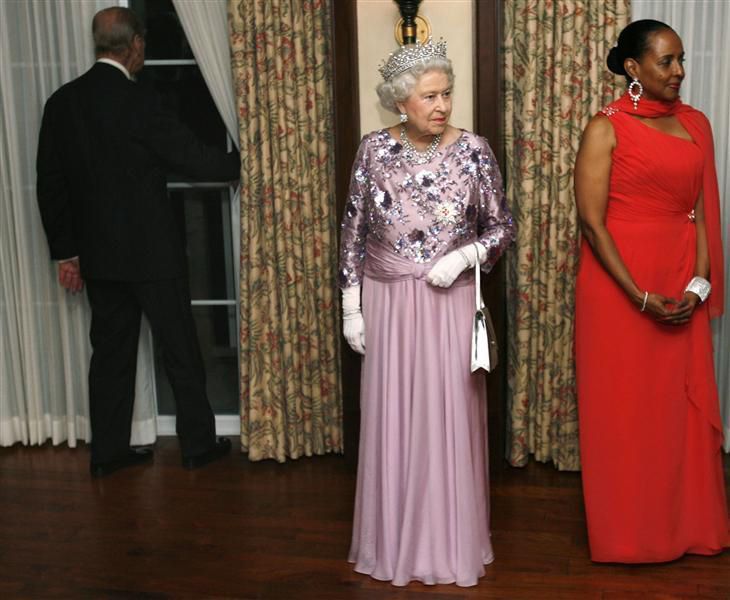 Queen Elizabeth waits in the receiving line at a state dinner in Bermuda