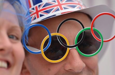 A spectator wears Olympic rings sunglass
