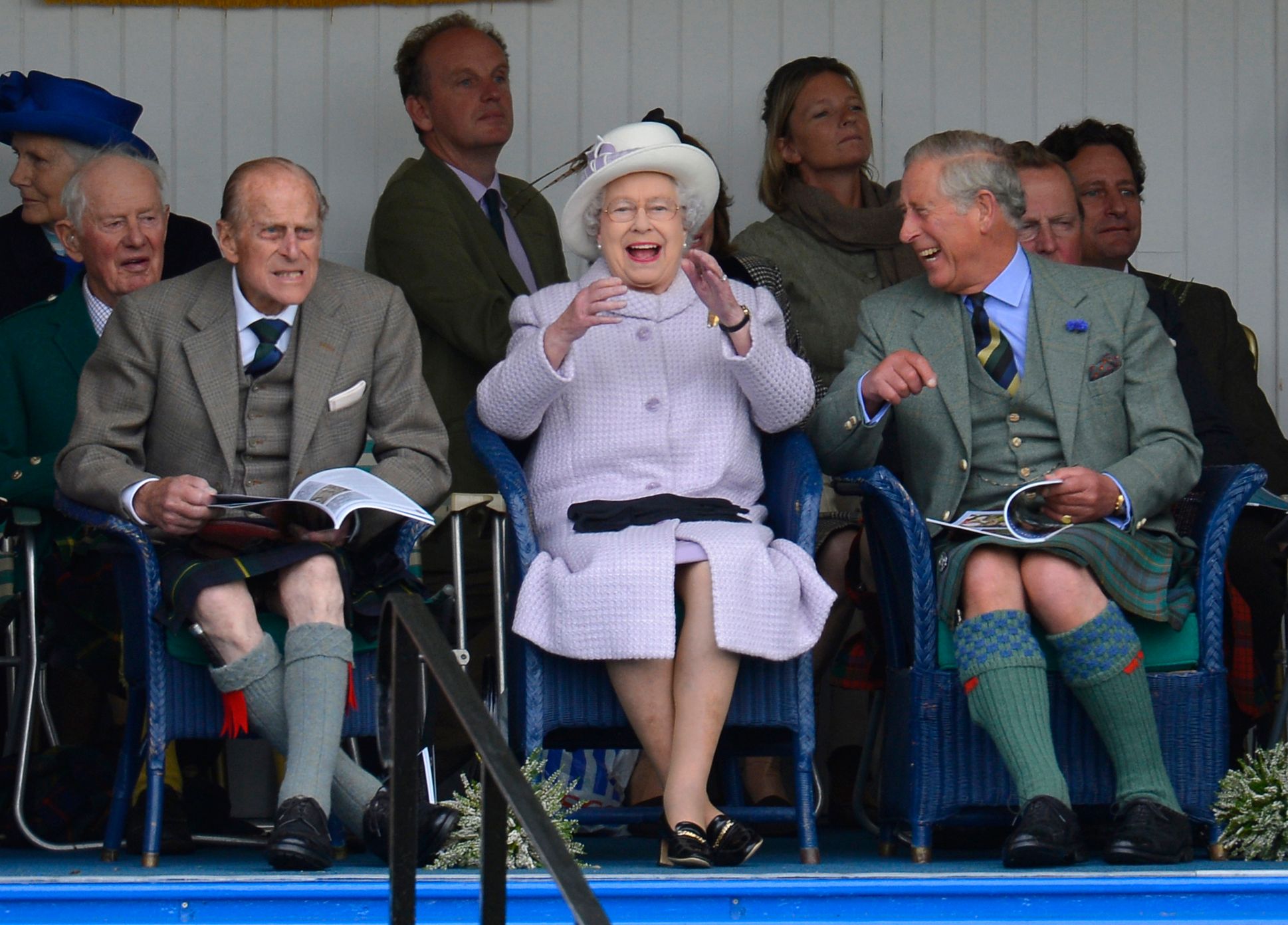 Members of Britain&#8217;s royal family cheer as competitors participate in a sack race at the Braemar Gathering in Braemar