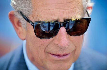 Emergency services member is reflected in the sunglasses of Britain&#8217;s Prince Charles during a reception at Bondi Icebergs swimming club in Sydney