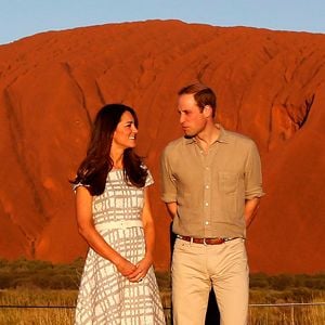 Britain&#8217;s Prince William and his wife Catherine, Duchess of Cambridge, pose in front of the Uluru