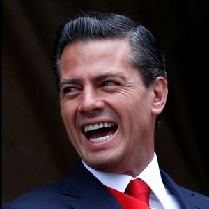 Mexico&#8217;s President Enrique Pena Nieto smiles during a military parade celebrating Independence Day at Zocalo Square in downtown Mexico City