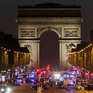 Police secure the Champs Elysees Avenue after one policeman was killed and another wounded in a shooting incident in Paris