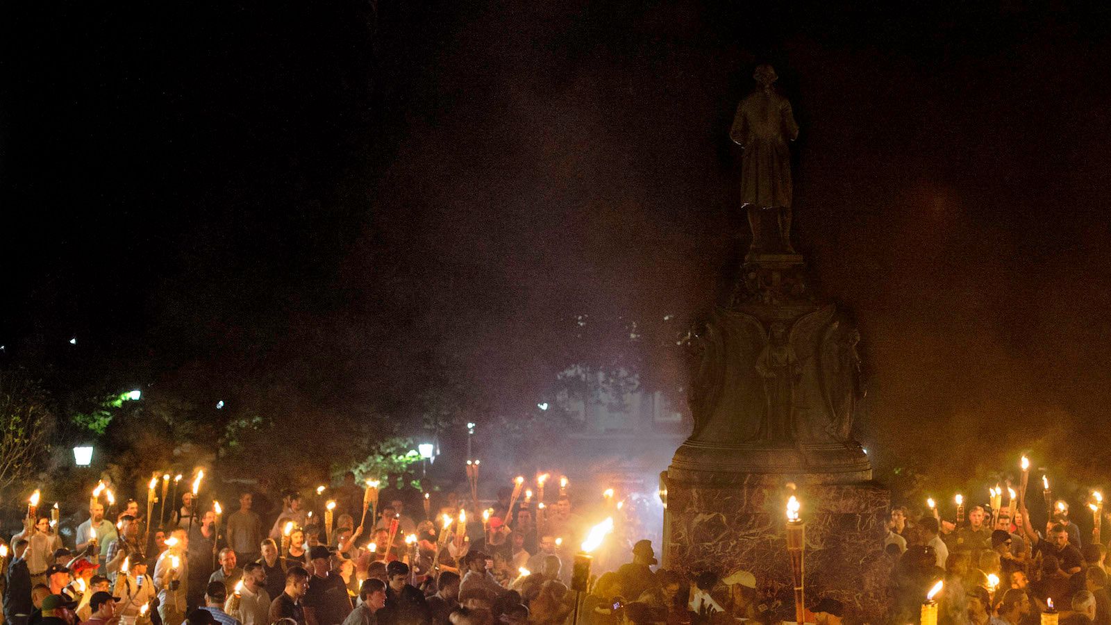 Marchers at a white-supremacy rally encircle counter protestors at the base of a statue of Thomas Jefferson after marching through the University of Virginia campus with torches in Charlottesville, Va., USA on August 11, 2017. (Shay Horse/NurPhoto via Getty Images)