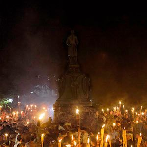 Marchers at a white-supremacy rally encircle counter protestors at the base of a statue of Thomas Jefferson after marching through the University of Virginia campus with torches in Charlottesville, Va., USA on August 11, 2017. (Shay Horse/NurPhoto via Getty Images)