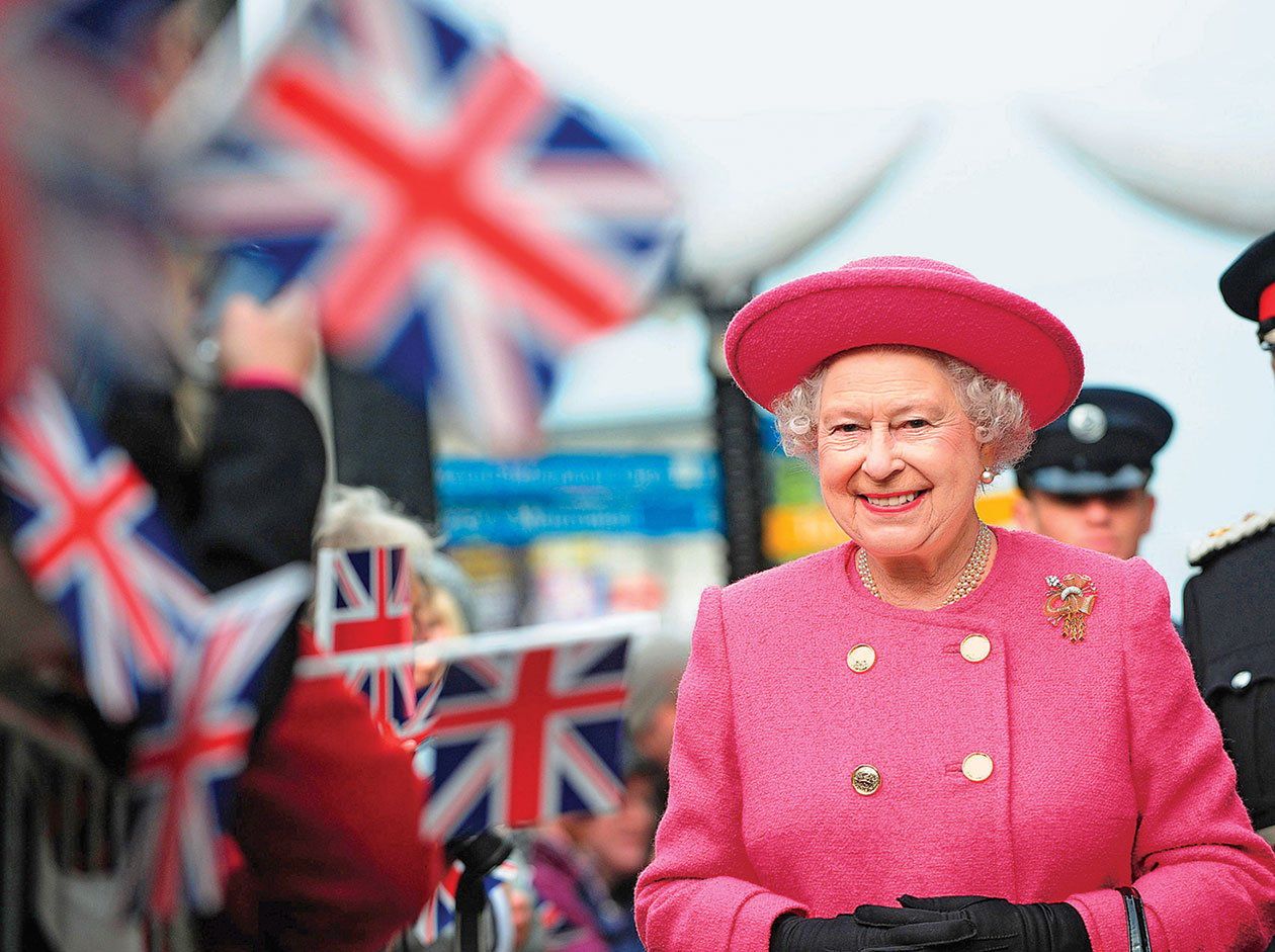 Britain&#8217;s Queen Elizabeth smiles as she walks during her visit to Newcastle