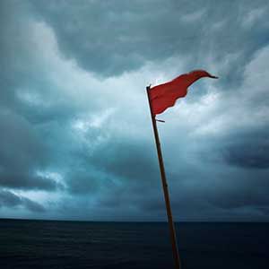 Red Flag Warning Hurricane Storm Danger of Dark Sea Clouds