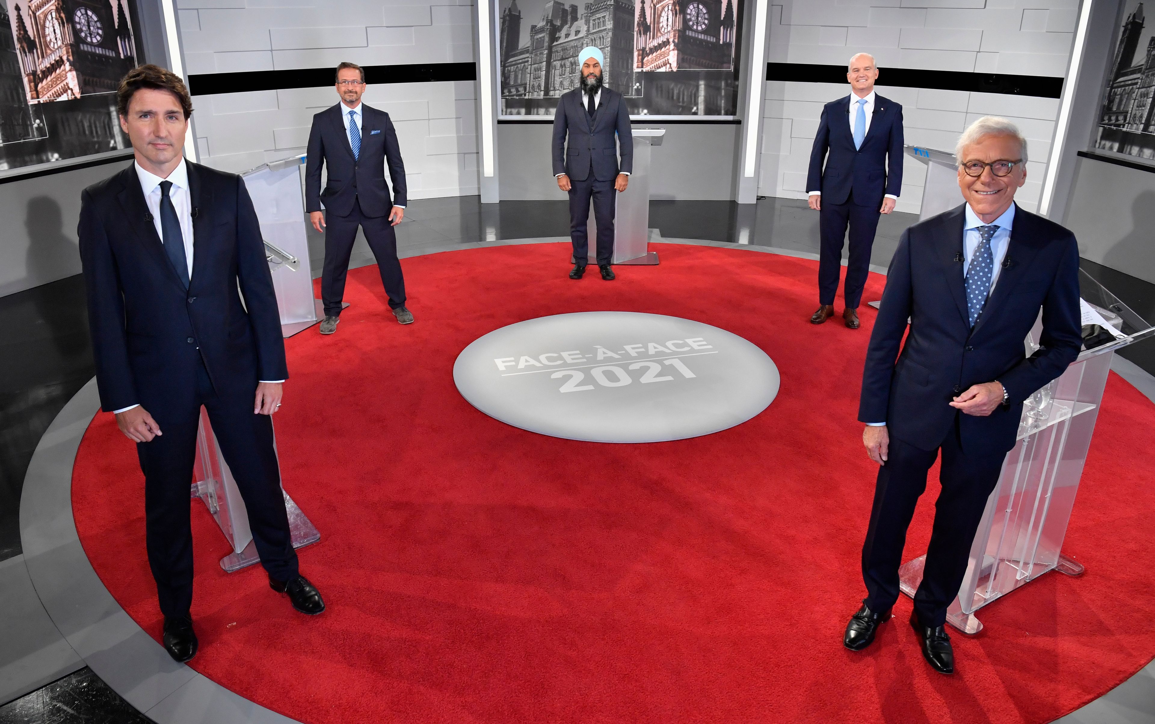 The official photo for the first French-language debate, left to right: Liberal Leader Justin Trudeau; Bloc Quebecois Leader Yves-Francois Blanchet; NDP Leader Jagmeet Singh; Conservative Leader Erin O'Toole; and debate moderator Pierre Bruneau. (Martin Chevalier/CP-pool)