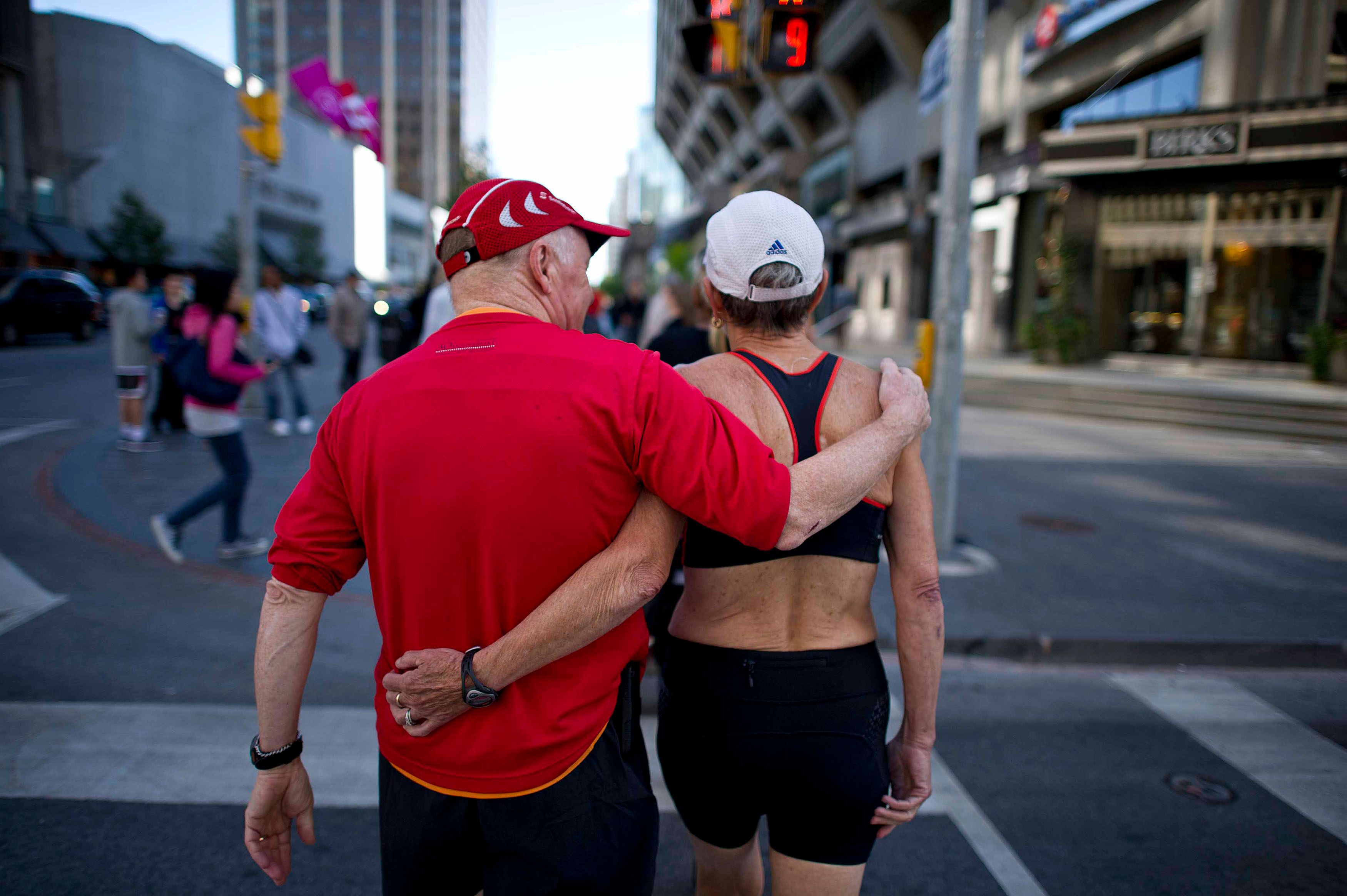 Bob and Jean walk eastward on Bloor Street after a morning run (Photograph by Cole Garside)