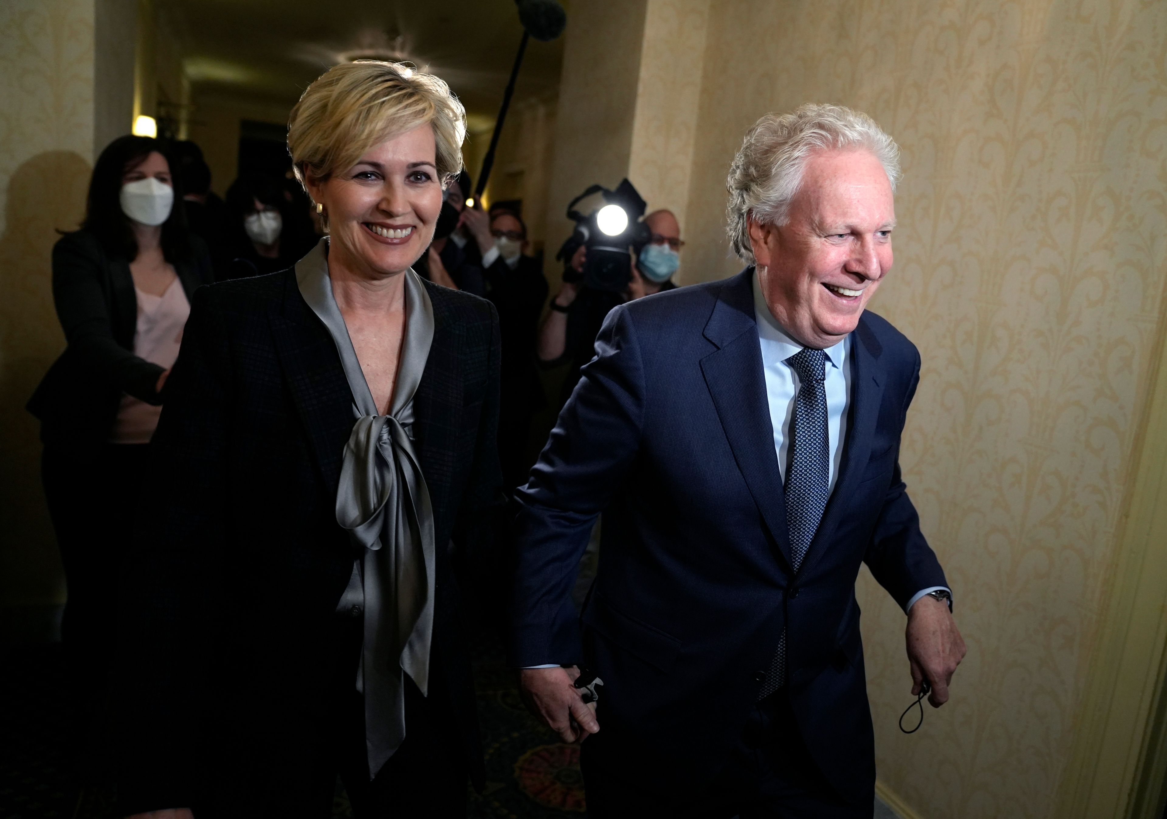 Charest arrives with his wife Michele Dionne for an event with potential caucus supporters, in Ottawa, March 2, 2022. (Justin Tang/The Canadian Press)