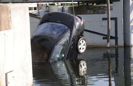 A car is removed from the Kingston Locks in this Shafia trial court photo released recently. A court is hearing that the young man accused of killing his sisters saw them plunge into a canal in a car, but didn't call for help. (The Canadian Press) 
