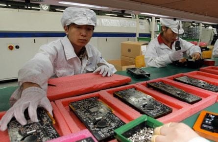 staff members work on the production line at the Foxconn complex in the southern Chinese city of Shenzhen. (Kin Cheung/AP Photo) 