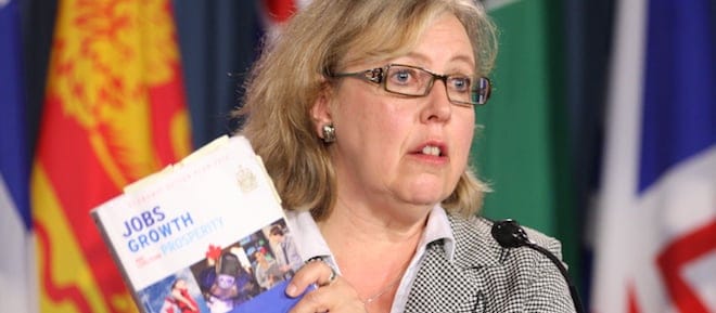 Green Party leader Elizabeth May holds a copy of Bill C-38 as she speaks about the budget bill in Ottawa on Monday, June 11, 2012. THE CANADIAN PRESS/Adrian Wyld