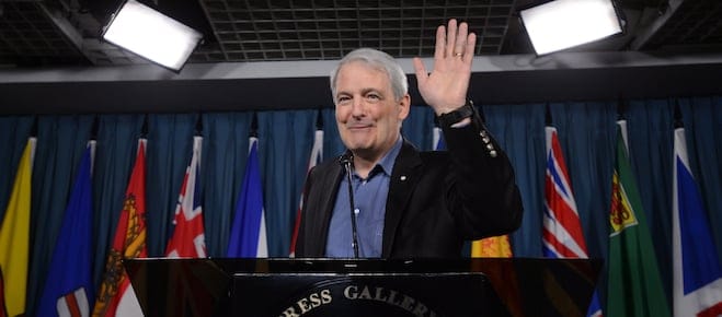 Liberal MP Marc Garneau pauses during a press conference on Parliament Hill in Ottawa on Wednesday, March 13, 2013 to announce his withdrawal from the Liberal leadership race. (Sean Kilpatrick/CP)