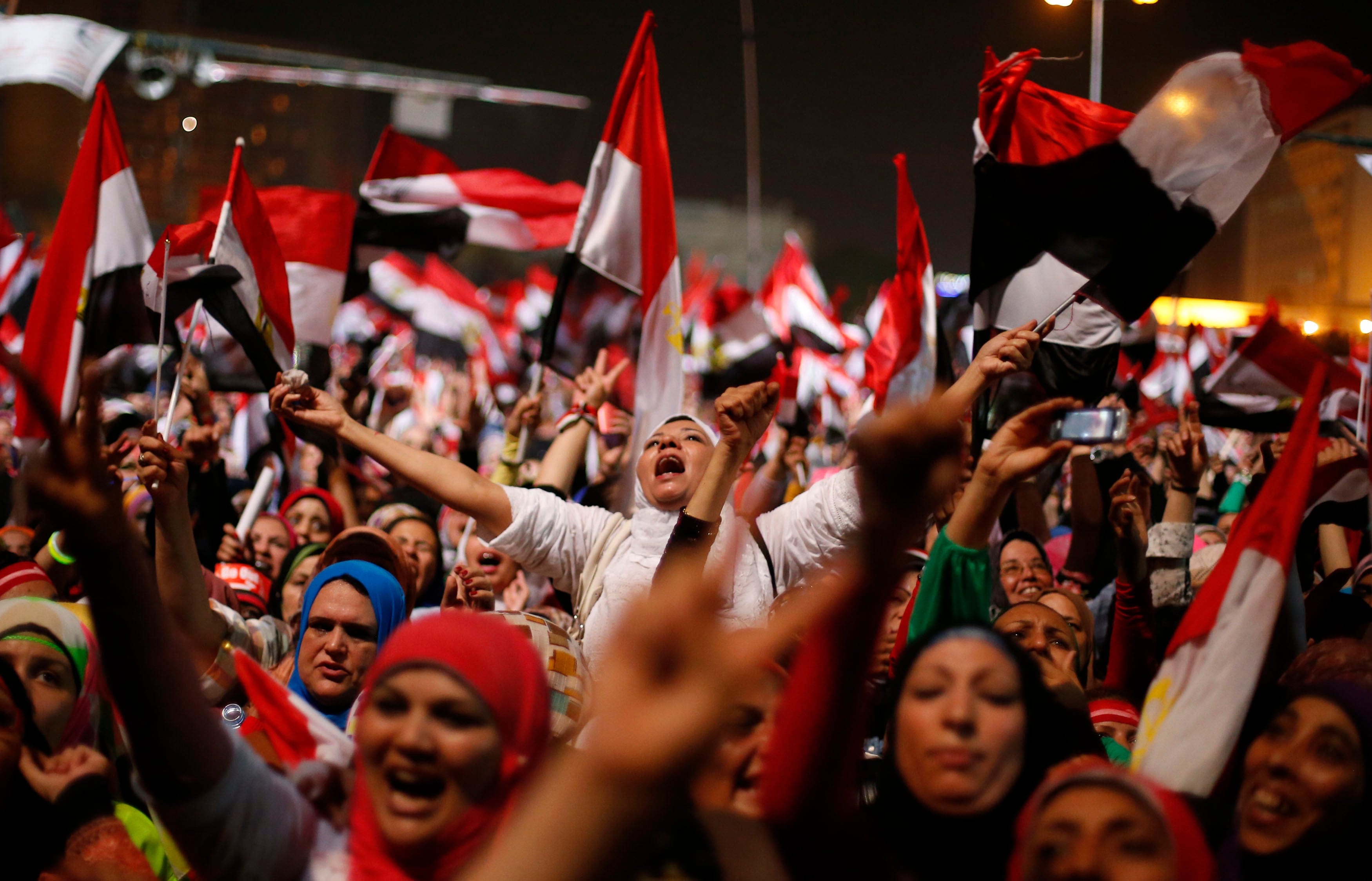 Protesters, who are against Egyptian President Mohamed Mursi, react in Tahrir Square in Cairo