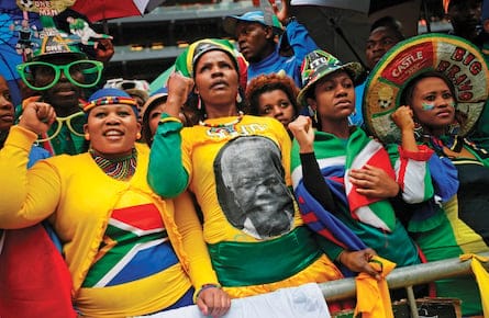 People sing and dance at official memorial service for Mandela in Johannesburg