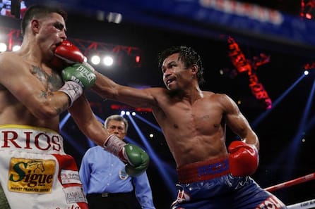 Pacquiao of the Philippines lands a punch on Rios of the U.S. during their WBO International 12-round welterweight boxing title fight at the Venetian Macao hotel in Macau
