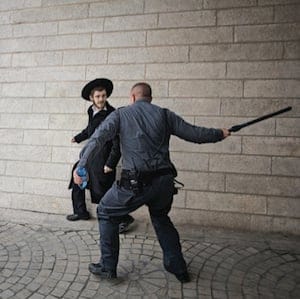 Israeli police officer and protester 300x300