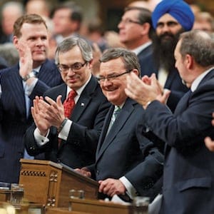 Canada's Finance Minister Jim Flaherty is applauded before delivering the federal budget in the House of Commons on Parliament Hill in Ottawa
