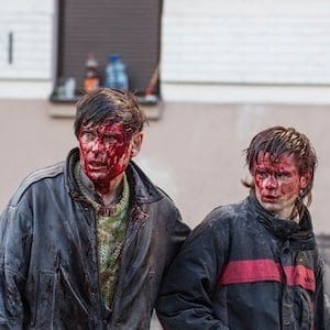 Wounded people are seen after clashes with riot police in central Kiev
