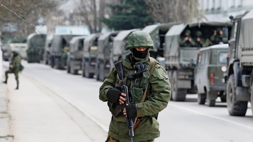 Armed servicemen wait in Russian army vehicles outside a Ukranian border guard post in the Crimean town of Balaclava March 1, 2014. (Baz Ratner, Reuters)