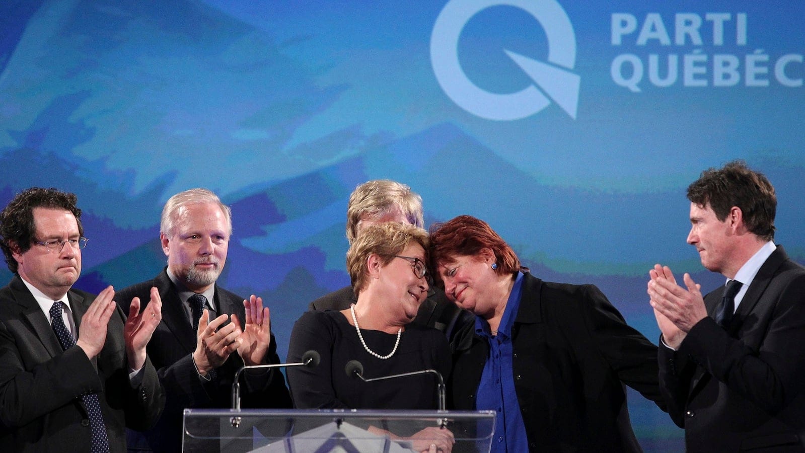 Parti Quebecois leader Pauline Marois embraces candidate Nicole Leger after delivering her concession speech at her provincial election night headquarters in Montreal