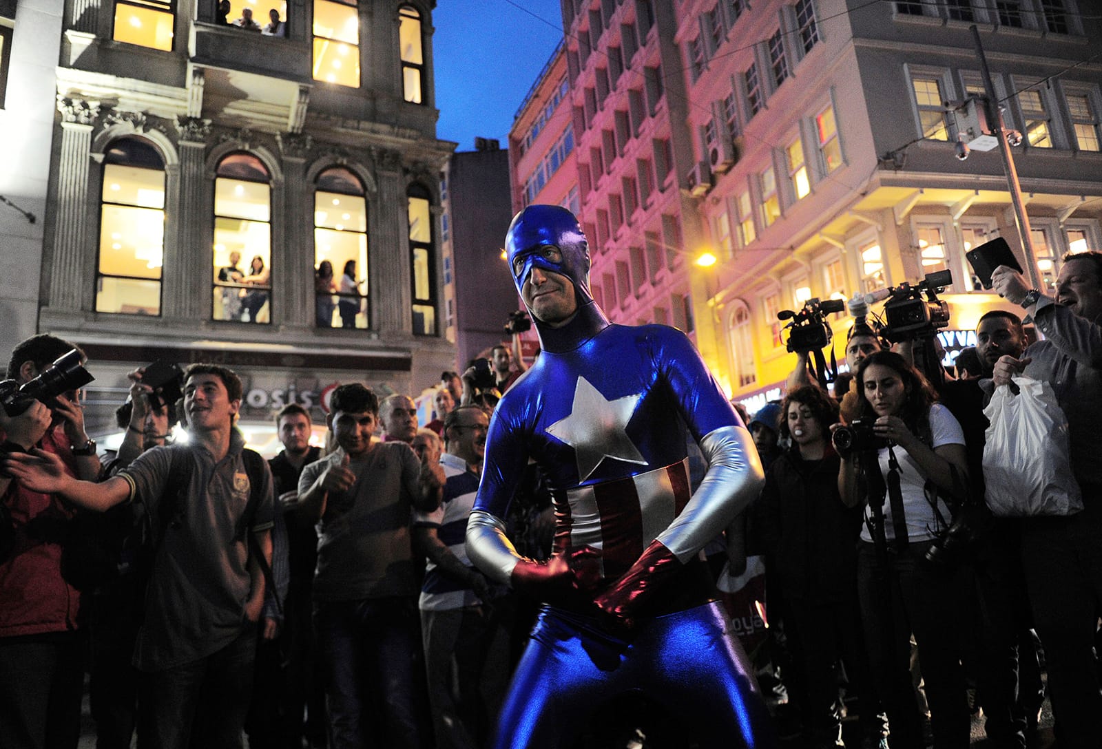 A man wearing a Captain America costume performs following an anti-government protest in central Istanbul, May 17, 2014. (Yagiz Karahan/Reuters)