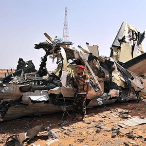 Rebels inspect an airplane destroyed by