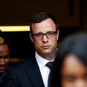 Paralympic track star Oscar Pistorius leaves after listening to the closing arguments in his murder trial at the high court in Pretoria