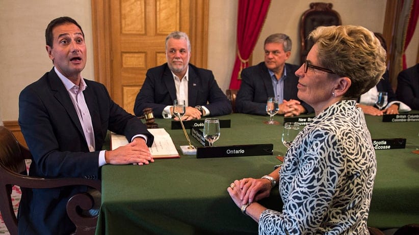 Prince Edward Island Premier Robert Ghiz, Quebec Premier Philippe Couillard, New Brunswick Premier David Alward and Ontario Premier Kathleen Wynne, left to right, attend the opening session at the Council of the Federation meeting in Charlottetown on Thursday, August 28, 2014. THE CANADIAN PRESS/Andrew Vaughan