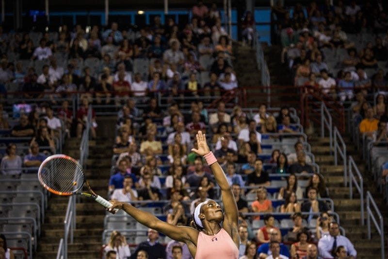 Sloane Stephens of the USA serves to Aleksandra Wozniak of Canada.
