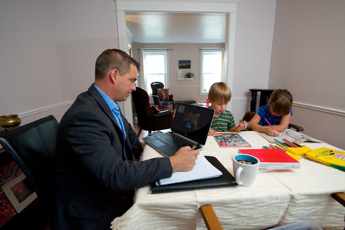 Distance learning: Eric Hill skypes from home with a fellow student in another city. (Photograph by Dean Casavechia)