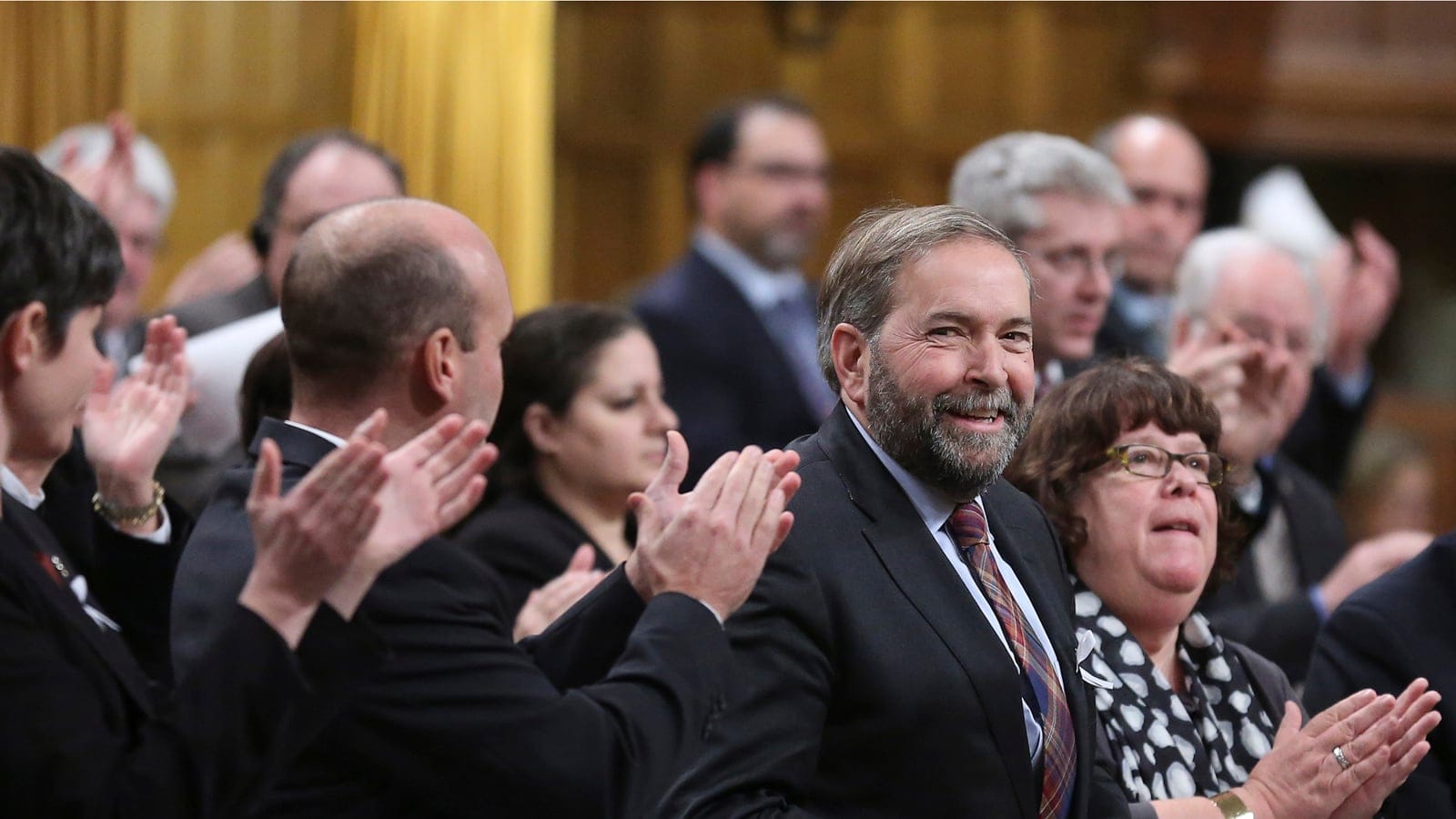 NDP leader Mulcair receives a standing ovation from his caucus during Question Period in the House of Commons on Parliament Hill in Ottawa