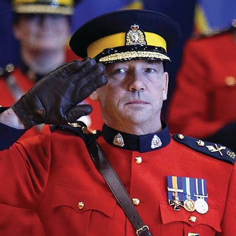 New RCMP Commissioner Paulson salutes during a change of command ceremony in Ottawa