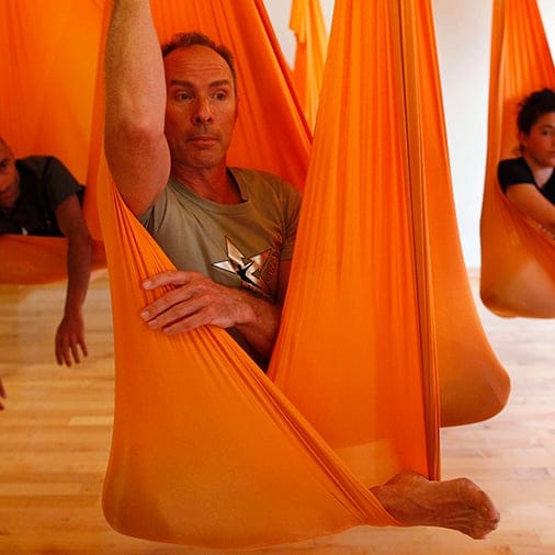 Antigravity Inc. founder Harrison sits in a hammock as he conducts a class of "antigravity" yoga class at the Om Factory in New York