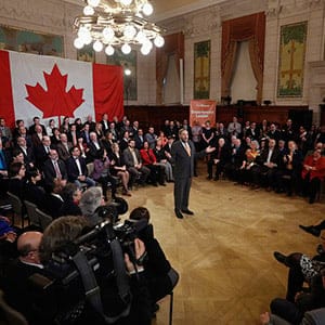 NDP leader Mulcair delivers a speech to his caucus on Parliament Hill in Ottawa