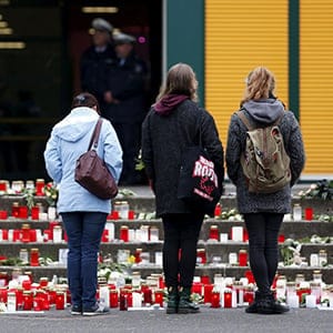 Students stand in front of the Joseph-Koenig-Gymnasium high school in Haltern am See