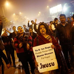 Demonstrators shout slogans during a candlelight vigil to mark the first anniversary of Delhi gang rape, in New Delhi