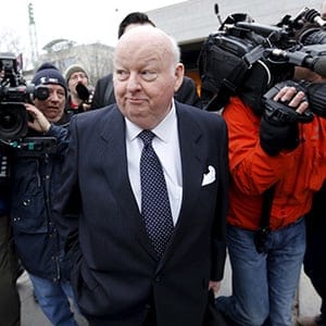 Suspended Senator Mike Duffy leaves the Ontario Court of Justice, in Ottawa