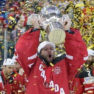 Canada’s goalkeeper Mike Smith lifts the trophy after his team defeated Russia in the Hockey World Championships gold medal match in Prague, Czech Republic, Sunday, May 17, 2015. Petr David Josek/AP
