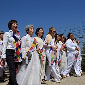 U.S. activist Gloria Steinem (C), and Nobel Peace Prize laureates Leymah Gbowee (R), from Liberia with other activists march to the Imjingak Pavilion  along the military wire fences near the border village of Panmunjom on May 24, 2015 in Paju, South Korea. A group of female peace activists including U.S. activist Gloria Steinem and Irish Nobel Peace Prize laureate Mairead Maguire march across the Demilitarized Zone (DMZ) from the North Korea to the South Korea to deliver a peace message on the International Women's Day for Peace and Disarmament. The DMZ bisects the Korean Peninsula, a legacy of the 1950-53 Korean War.  (Chung Sung-Jun/Getty Images)
