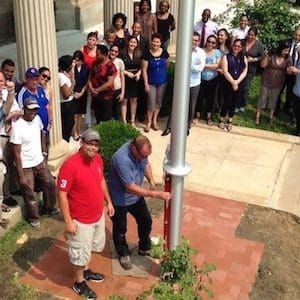 People gathered to watch as a work crew installed a flagpole at the site of a future Cuban embassy in the U.S., on June, 10, 2015, following the historic reopening of ties between those countries. THE CANADIAN PRESS/HO - Peter Mullaly