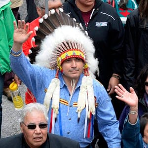 Assembly of First Nations Chief Perry Bellegarde (in headdress) and Justice Murray Sinclair (in black suit), TRC commissioner, march during the Walk for Reconciliation, part of the closing events of the Truth and Reconciliation Commission on Sunday, May 31, 2015 in Gatineau, Que. Beginning in the 1870s, over 150,000 First Nations, Metis and Inuit children were required to attend government-funded, church-run residential schools in an attempt to assimilate them into Canadian society; the last school closed in 1996. Students were prohibited from speaking their own languages, practicing their culture and often experienced physical and sexual abuse. Justin Tang/CP
