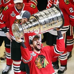 Antoine Vermette #80 of the Chicago Blackhawks celebrates by hoisting the Stanley Cup after defeating the Tampa Bay Lightning  by a score of 2-0 in Game Six to win the 2015 NHL Stanley Cup Final at the United Center  on June 15, 2015 in Chicago, Illinois.  (Jonathan Daniel/Getty Images)