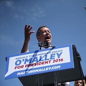 BALTIMORE, MD - MAY 30:  Former Maryland Gov. Martin O'Malley (L) speaks as his wife Katie (R) looks on during an event to announce his candidacy for a presidential campaign May 30, 2015 at Federal Hill Park in Baltimore, Maryland. O'Malley was the third Democrat, after former U.S. Secretary of State Hillary Clinton and Sen. Bernie Sanders (I-VT), to throw his hat in the ring for the Democratic nomination. (Alex Wong/Getty Images)