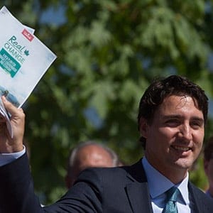 Liberal Leader Justin Trudeau holds a copy of his environmental platform after announcing details of it at Jericho Beach Park in Vancouver, B.C., on Monday June 29, 2015. THE CANADIAN PRESS/Darryl Dyck