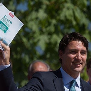 Liberal Leader Justin Trudeau holds a copy of his environmental platform after announcing details of it at Jericho Beach Park in Vancouver, B.C., on Monday June 29, 2015. THE CANADIAN PRESS/Darryl Dyck