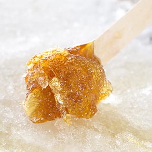 Maple taffy rolling. Shutterstock.