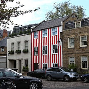 LONDON, ENGLAND - APRIL 29:  A townhouse that was painted in red and white stripes by its owner Zipporah Lisle-Mainwaring after a planning dispute with her neighbours is pictured on April 29, 2015 in London, England. Mrs Lisle-Mainwaring has since been ordered by the local council, the Royal Borough of Kensington and Chelsea, to paint it white and restore the window frames.  (Carl Court/Getty Images)